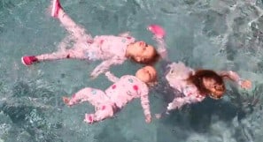 children floating on water