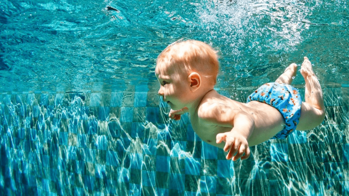 child safely learning to swim